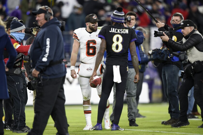 Baltimore Ravens quarterback Lamar Jackson (8) talks with Cleveland Browns quarterback Baker Mayfield (6) at the end of an NFL football game, Sunday, Nov. 28, 2021, in Baltimore. The Ravens won 16-10. (AP Photo/Gail Burton)