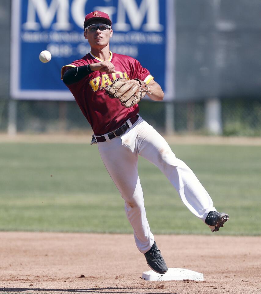 Glendale College's Christian Muro throws out a Victor Valley College runner at first base in a Western States Conference baseball game at Stengel Field in Glendale on Tuesday, April 23, 2019.
