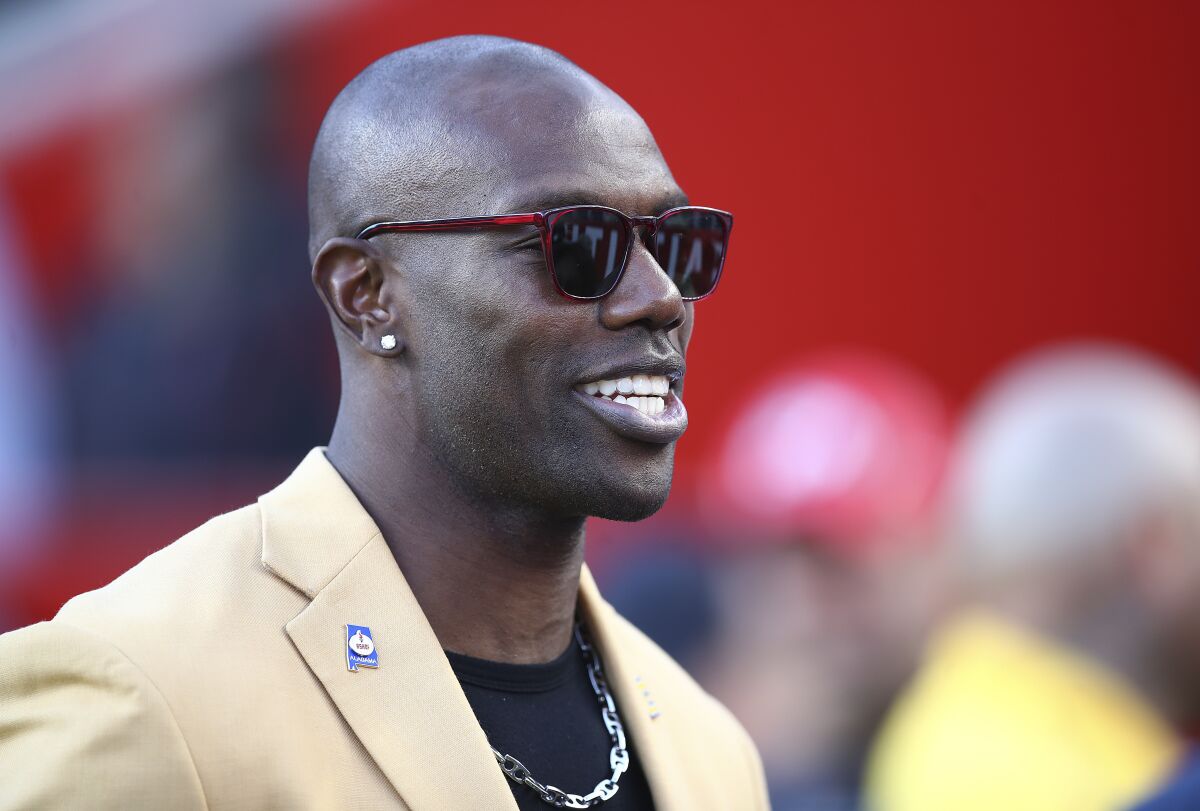 FILE - Former NFL wide receiver Terrell Owens is shown before an NFL football game between the San Francisco 49ers and the Oakland Raiders in Santa Clara, Calif., on Nov. 1, 2018. Owens said a fight caught on camera in which he punched a man in a CVS parking lot was the result of an “aggressor” threatening him and a fan he was talking to at the California store on Saturday, Nov. 26, 2022. (AP Photo/Ben Margot, File)