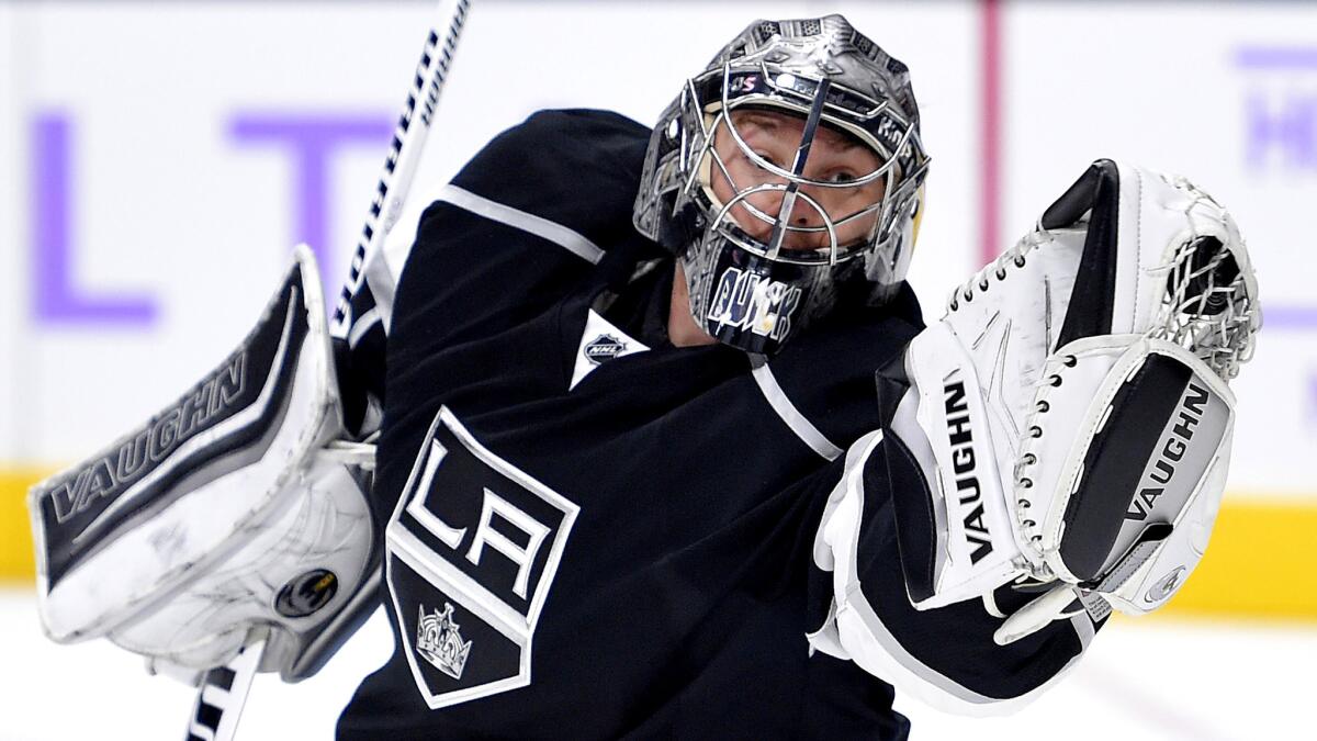 Kings goalie Jonathan Quick makes a save during the first period of the game against the Hurricanes on Friday night at Staples Center.