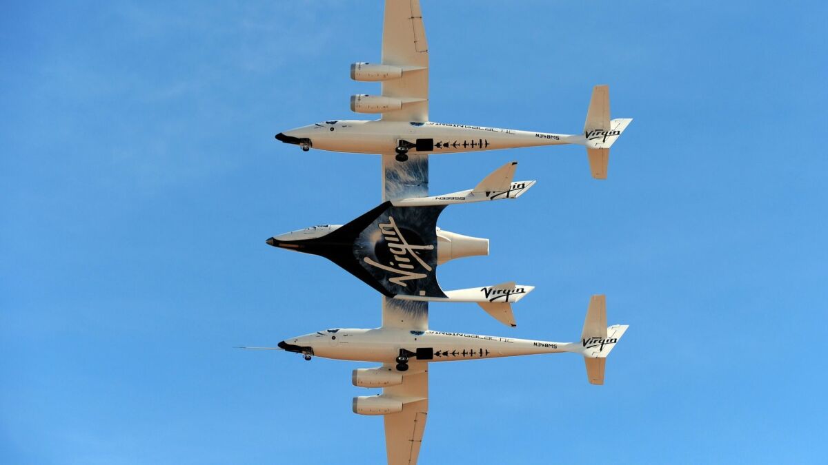 Virgin Galactic's WhiteKnightTwo aircraft carries one of its spaceships near Las Cruces, New Mexico in October, 2010.