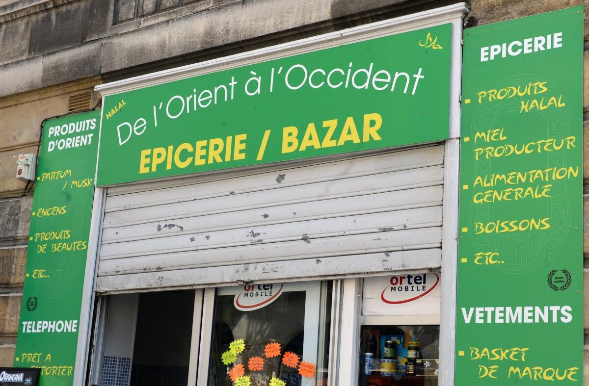 A Muslim-owned grocery store in the Saint-Michel neighborhood of Bordeaux on June 22. The shop sparked controversy by having affixed to its window a placard indicating separate opening days for men and women, a decision that was judged illegal and discriminating by local authorities.