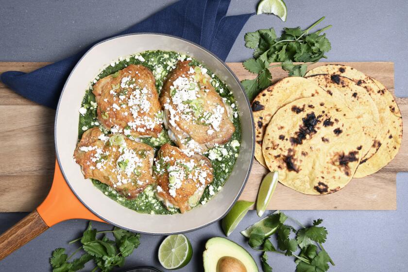 LOS ANGELES, CA-April 2, 2019: Chicken thighs braised in salsa verde made with spring onions and white wine. (Mariah Tauger / Los Angeles Times)