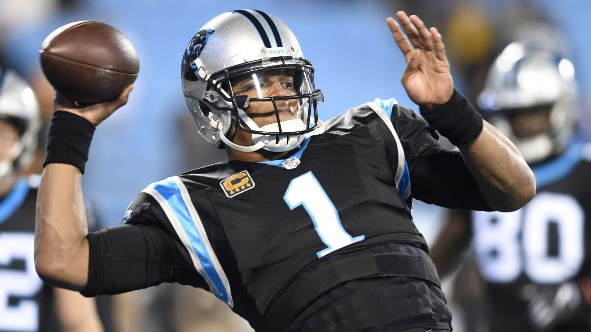 In this Dec. 17, 2018 file photo, Carolina Panthers' Cam Newton (1) warms up before an NFL football game against the New Orleans Saints in Charlotte, N.C.