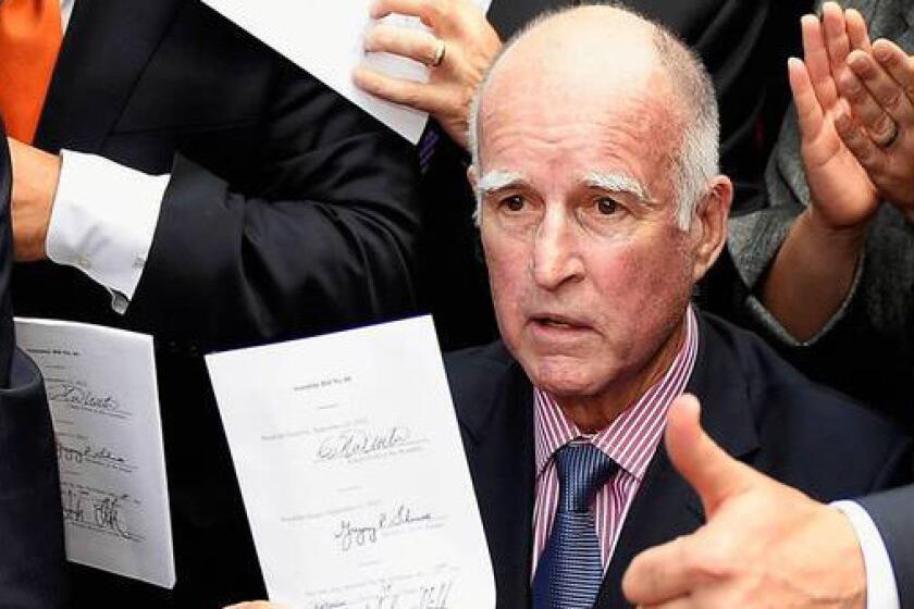 California Gov. Jerry Brown is shown at a bill-signing at Los Angeles City Hall earlier this month. There was something for everyone in his signings and vetoes. He liberalized some social policies, blocked some ideas that conservatives disliked and took the middle ground on many other matters.