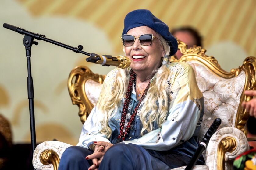 Joni Mitchell on stage in a surprise appearance at the Newport Folk Festival in Newport, R.I. on Sunday, July 24, 2022.