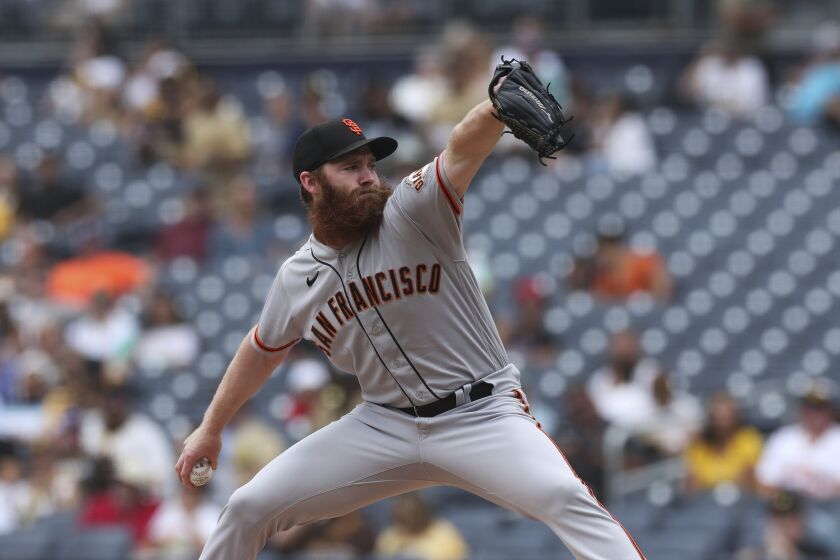 San Francisco Giants starting pitcher John Brebbia winds up against the San Diego Padres in the first inning of a baseball game, Wednesday, Oct. 5, 2022, in San Diego. (AP Photo/Derrick Tuskan)