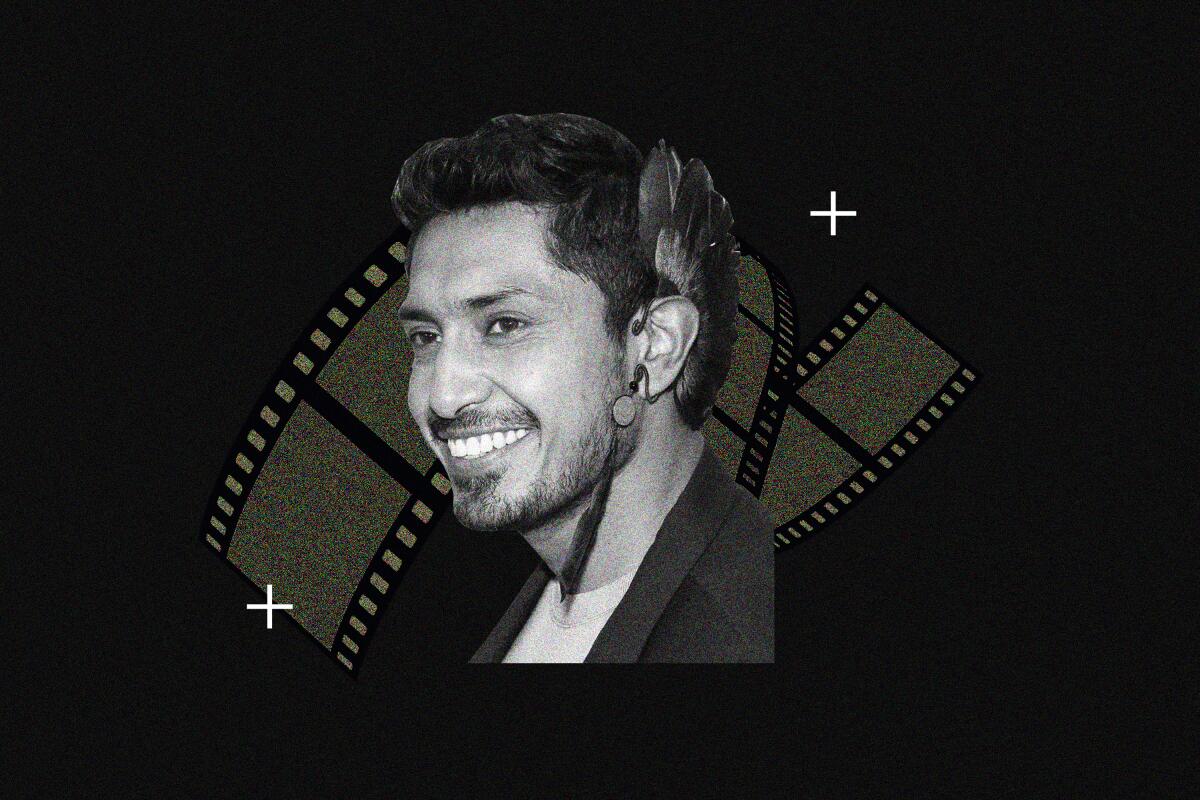 Photo of Tenoch Huerta in front of a movie reel