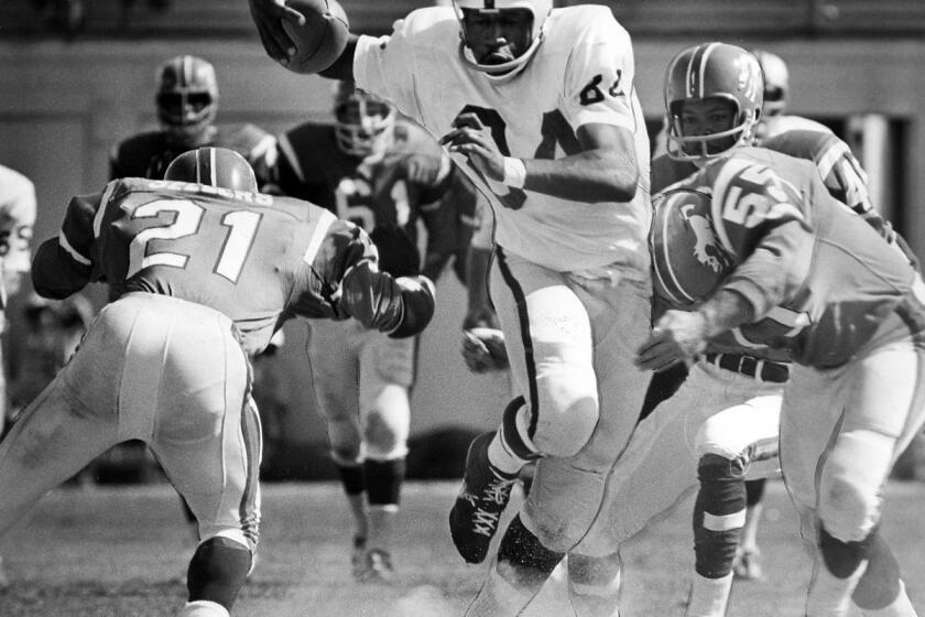 Tribune file photo by Howard Erker August 1966 Art Powell swings his way through Denver's Goldie Sellers (21) and old teammate Archie Matsos for 17yard aerial gain in a Raider win.(Digital First Media Group/Oakland Tribune via Getty Images)