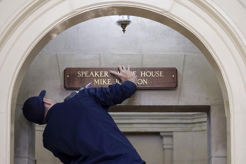 A new sign is installed above the entrance to the office of House Speaker Mike Johnson, R-La., Wednesday, Oct. 25, 2023, at the Capitol in Washington. Republicans eagerly elected Johnson as House speaker on Wednesday, elevating a deeply conservative but lesser-known leader to the seat of U.S. power and ending for now the political chaos in their majority. (AP Photo/Mariam Zuhaib)