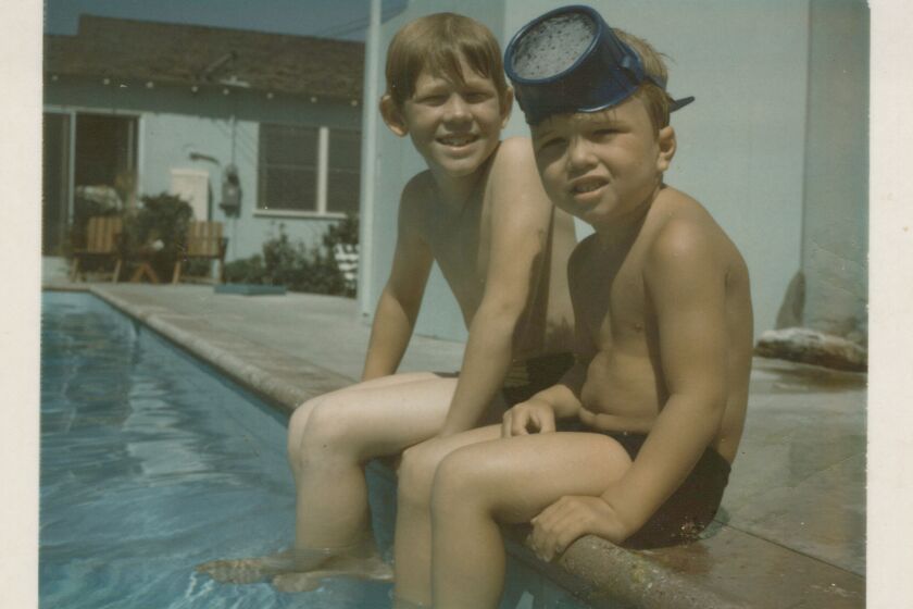 A photo from "The Boys: A Memoir of Hollywood and Family Book" by Ron Howard and Clint Howard. Pictured: : "Ron and Clint in Swimming Pool"] Poolside on Cordova Street.