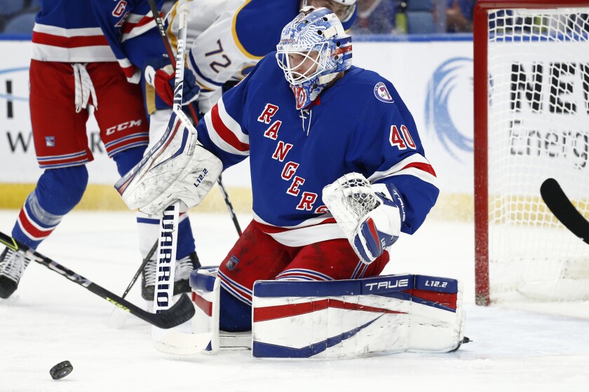New York Rangers goaltender Alexandar Georgiev (40) makes a save during the first period of the team's NHL hockey game against the Buffalo Sabres, Friday, Dec. 10, 2021, in Buffalo, N.Y. (AP Photo/Jeffrey T. Barnes)