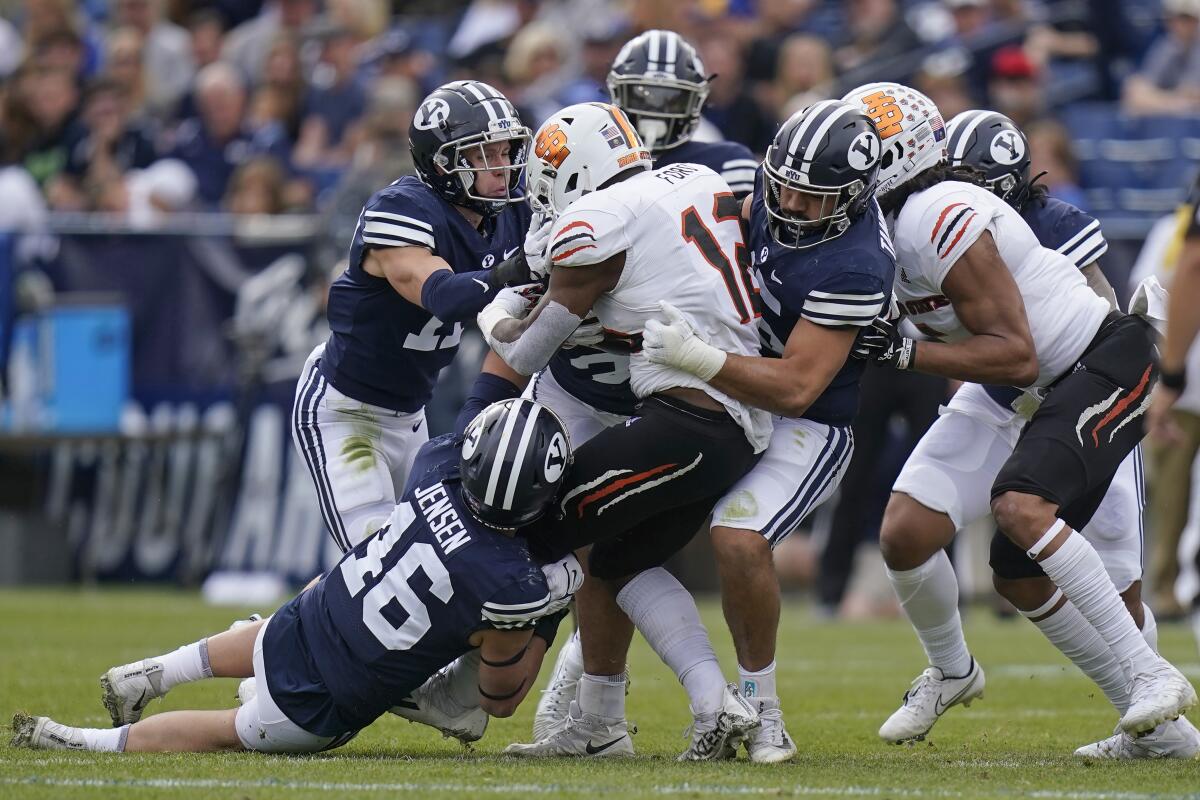Idaho State's Tyevin Ford is tackled by a host of BYU players Nov. 6, 2021, in Provo, Utah. 