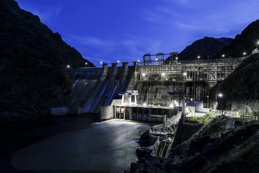 Hells Canyon,Oregon, Wednesday, April 26, 2023- The Snake River rushes through Hell's Canyon Dam as night falls. (Robert Gauthier/Los Angeles Times)