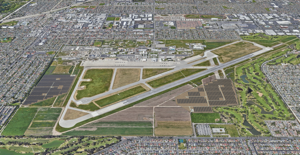 An aerial rendering shows proposed fields of solar panels on both sides of Los Alamitos Army Airfield.