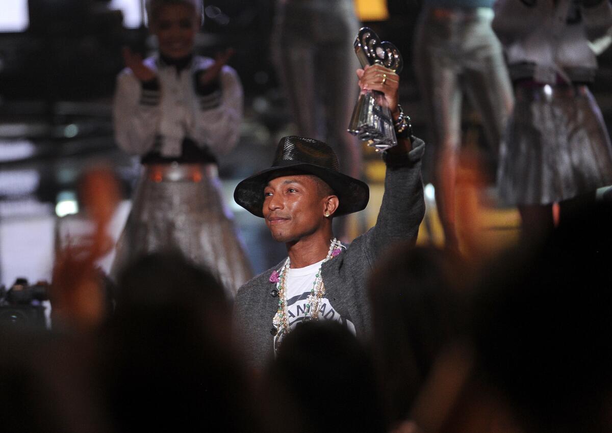 Pharrell Williams accepts the award for iHeartRadio innovator at the iHeartRadio Music Awards at the Shrine Auditorium on Thursday in Los Angeles.