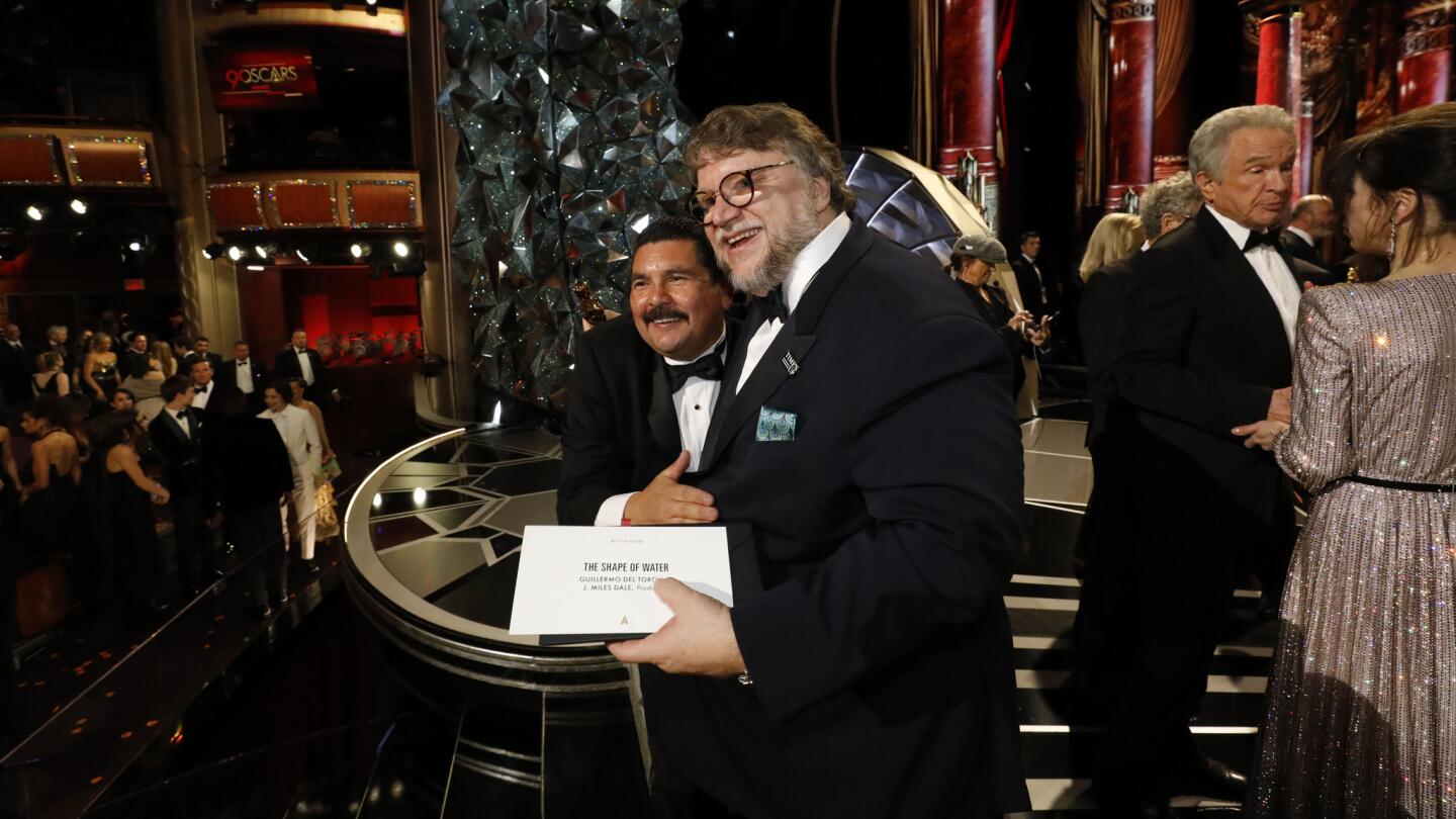 Oscar winner Guillermo Del Toro poses with Jimmy Kimmel pal Guillermo Rodriguez at the 90th Academy Awards.