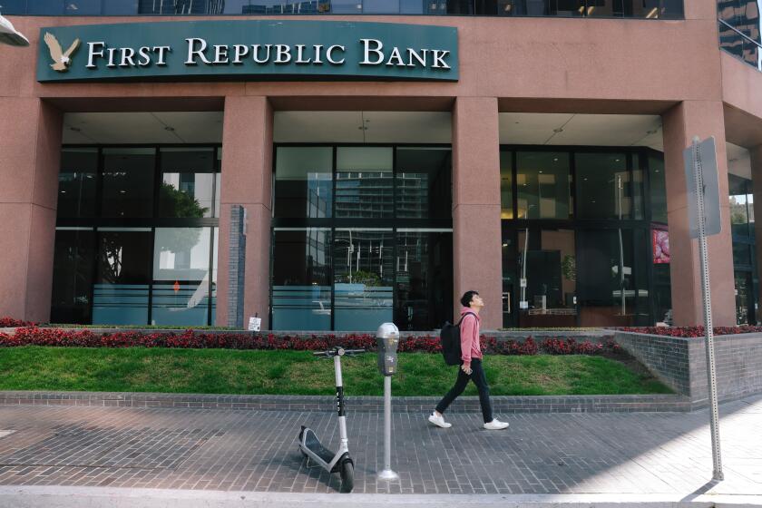 Los Angeles, CA - March 13: People pass the First Republic Bank downtown on Monday, March 13, 2023 in Los Angeles, CA. Dozens of customers lined up outside of a First Republic Bank in southern California on Saturday eager to withdraw their funds in the wake of the collapse of Silicon Valley Bank. There had been fears following SVB's demise for First Republic's future when analysts pointed out the similarities between the estimated value of their assets versus the actual value.(Dania Maxwell / Los Angeles Times).