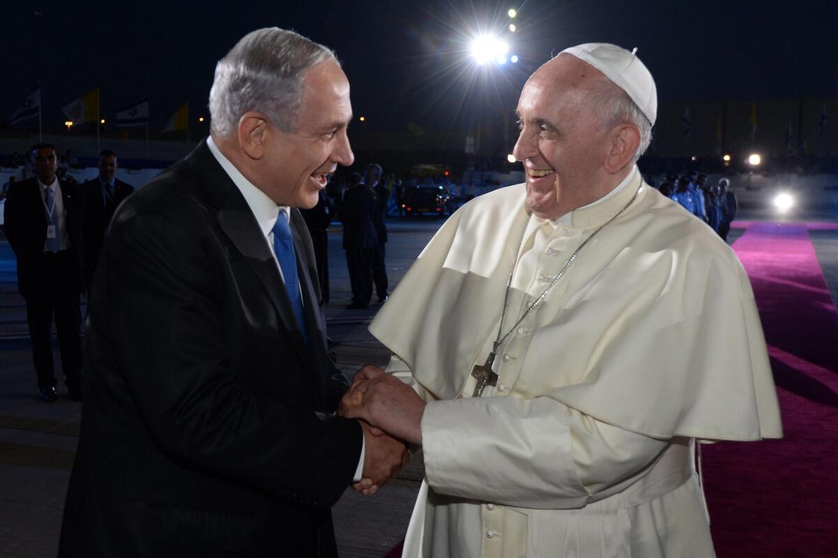 Pope Francis and Israeli Prime Minister Benjamin Netanyahu say goodbye at Ben Gurion Airport outside Tel Aviv.