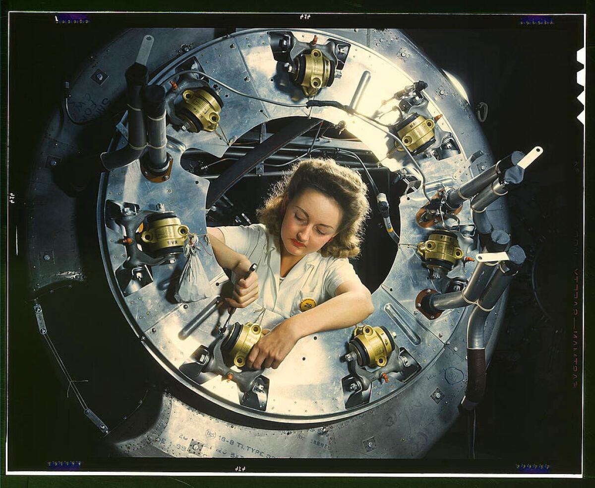 Part of the cowling for one of the motors for a B-25 bomber is assembled in the engine department of North American Aviation's Inglewood plant in October 1942.