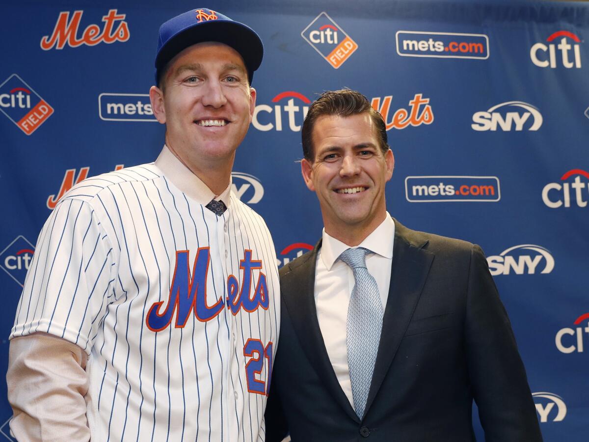 Todd Frazier, left, poses with his agent, Brodie Van Wagenen, right, after signing with the Mets this year.