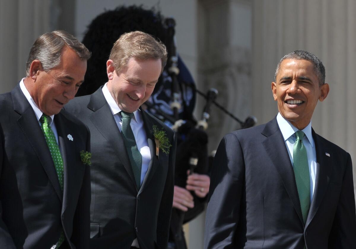 House Speaker John Boehner, left, Irish Prime Minister Enda Kenny and President Obama walk down the east steps of the Capitol after attending lunch.