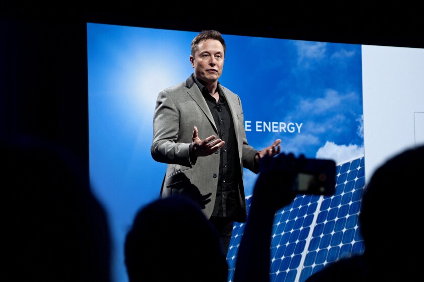 Tesla Chief Executive Elon Musk attends an event in Hawthorne touting solar energy.