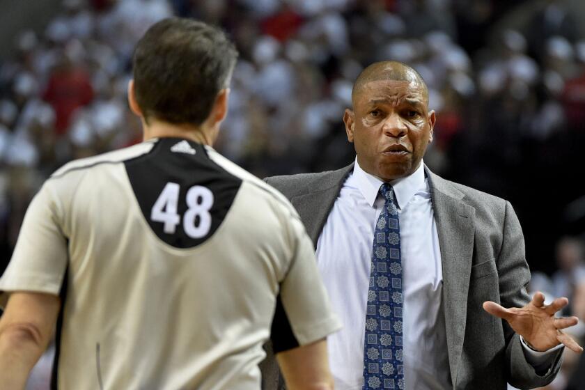 Clippers Coach Doc Rivers has some words with referee Scott Foster in the first quarter of Game 3 of the Western Conference first round playoff on Saturday.