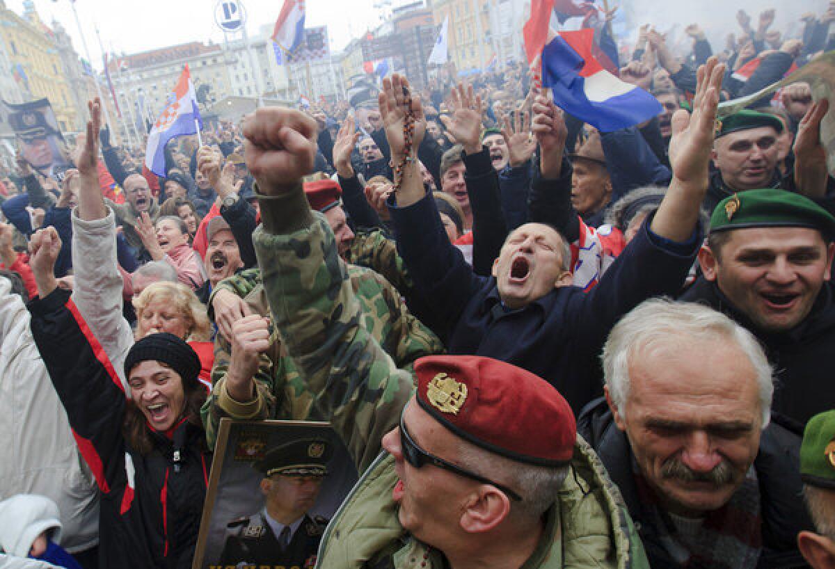 Croatian war veterans celebrate in central Zagreb after a live broadcast from The Hague showed the Yugoslav war crimes tribunal's decision to reverse two Croatian generals' convictions for atrocities during a 1995 offensive against Serbs.