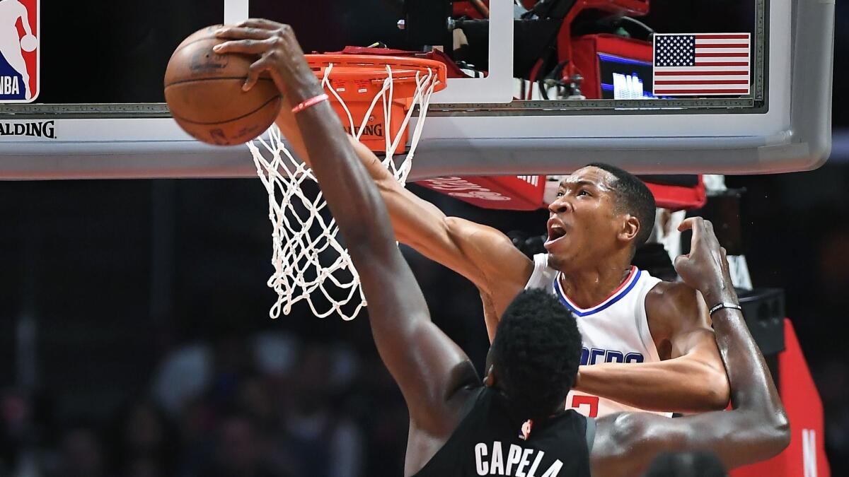 Wesley Johnson blocks the shot of Rockets' Clint Capela in the second quarter at the Staples Center on Jan. 15.