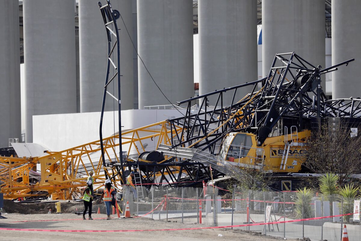 Fallen construction crane at SoFi Stadium on Friday.