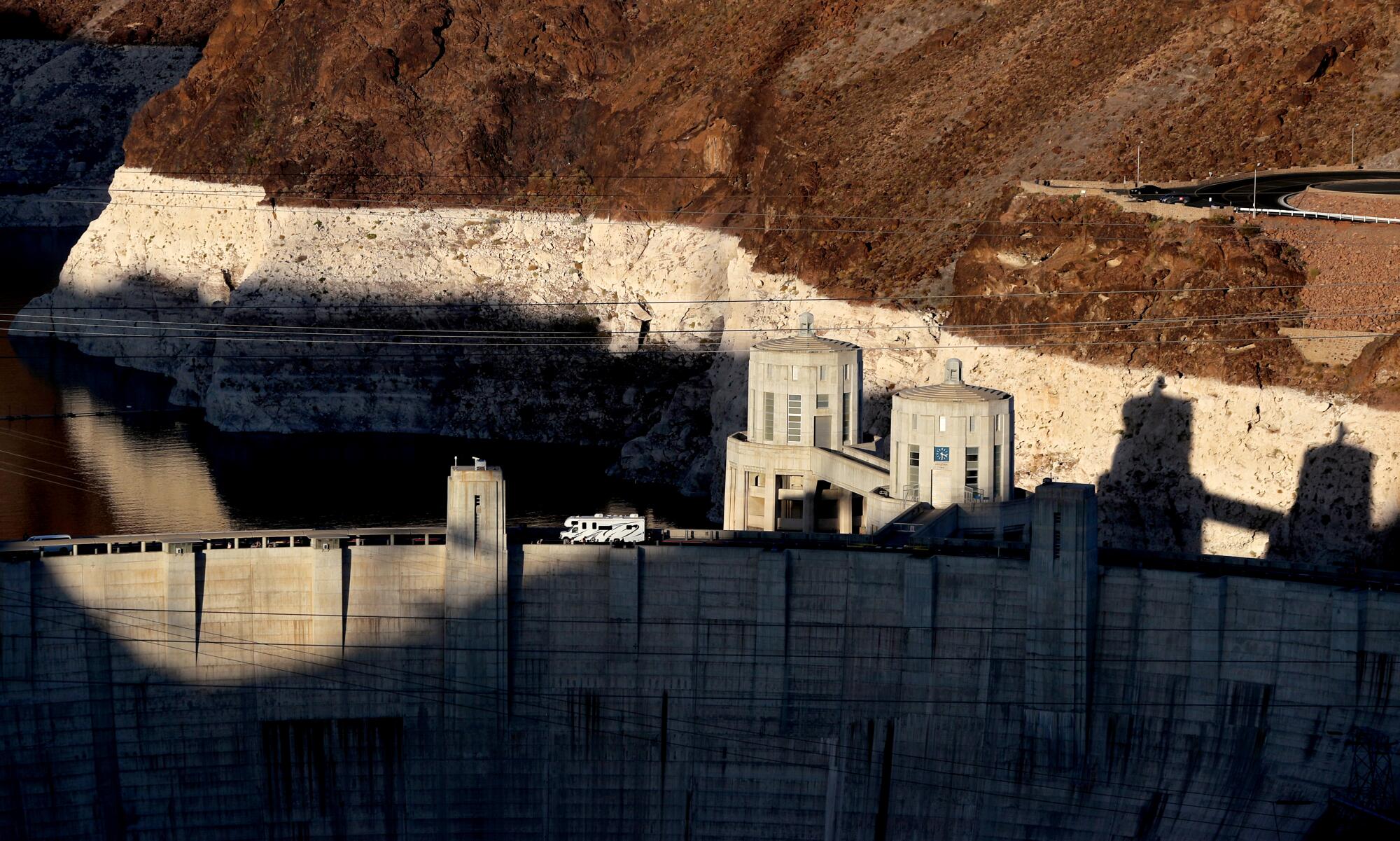 A motor home is dwarfed by the monumental size of the Hoover Dam near Boulder City. 