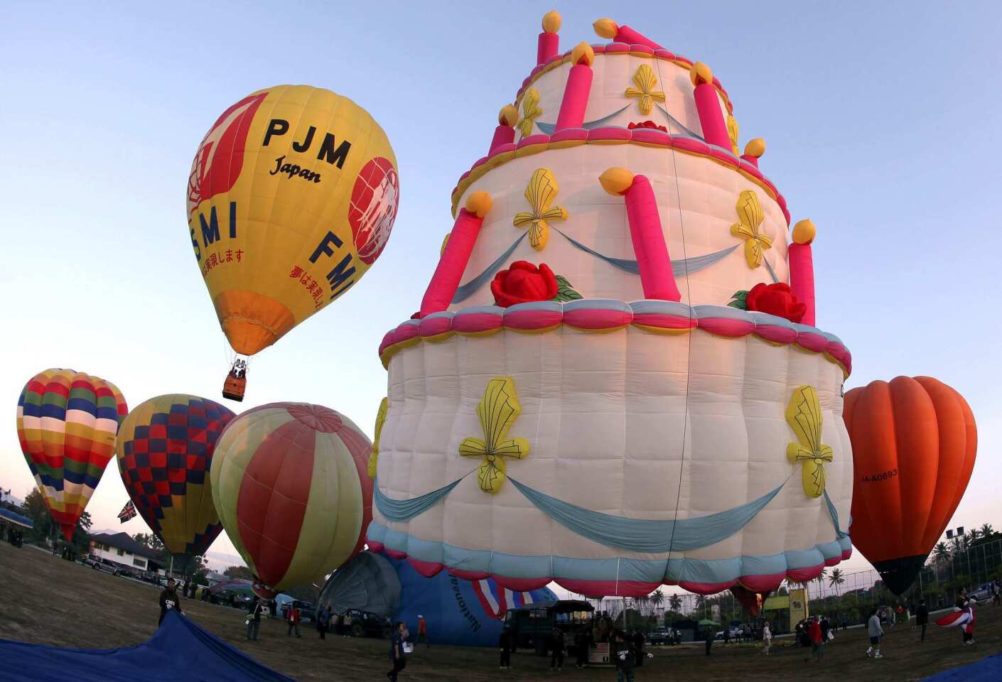 "Cake." This year's Chiang Mai International Balloon Fiesta, held in January, featured more than 20 balloons from countries all over the world, including Belgium, Japan, Malaysia, The Netherlands, Switzerland, United States of America and Vietnam. More info: chiangmaiballoon.com