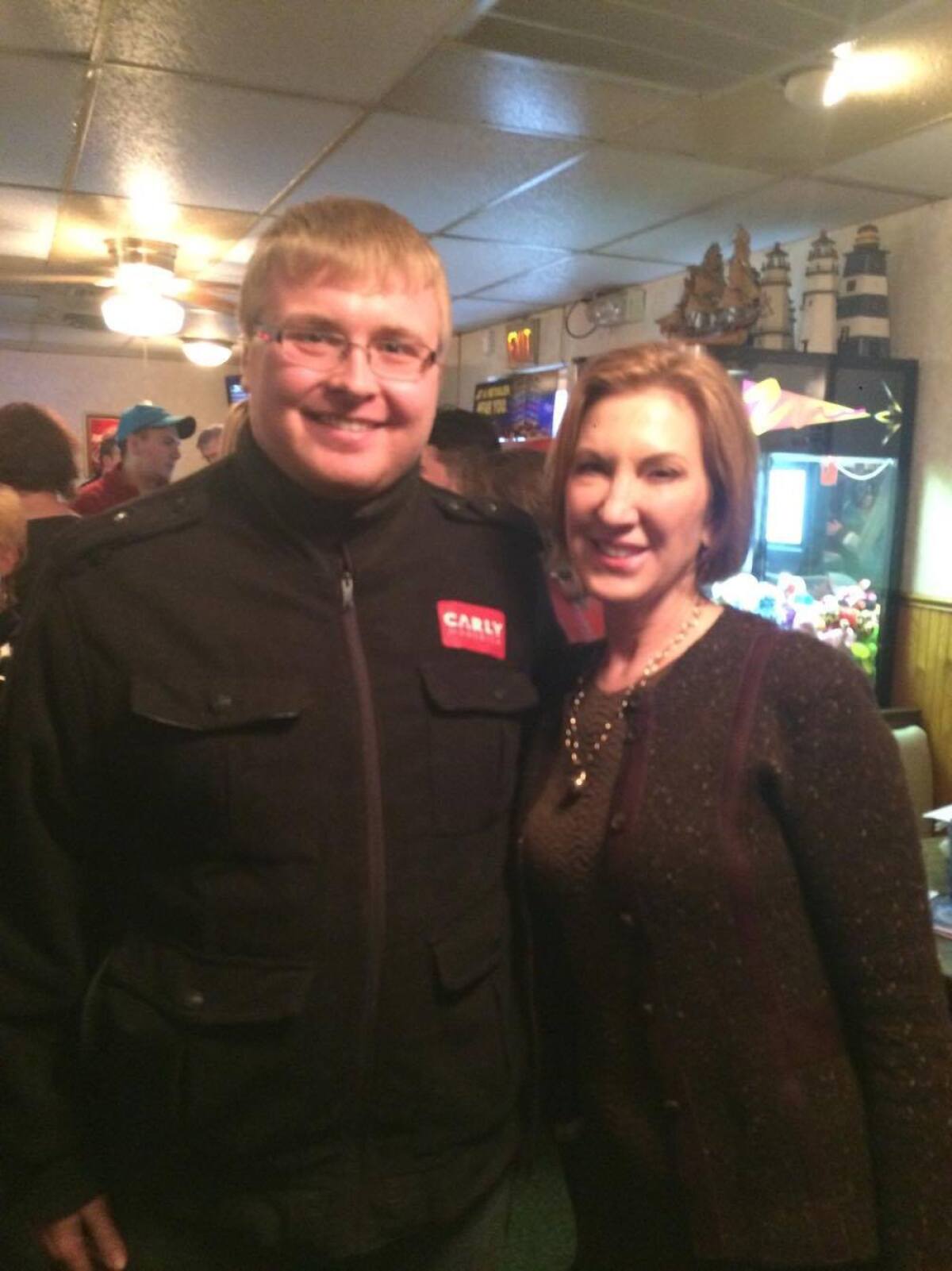 Iowa caucusgoer Charlie Comfort and presidential hopeful Carly Fiorina