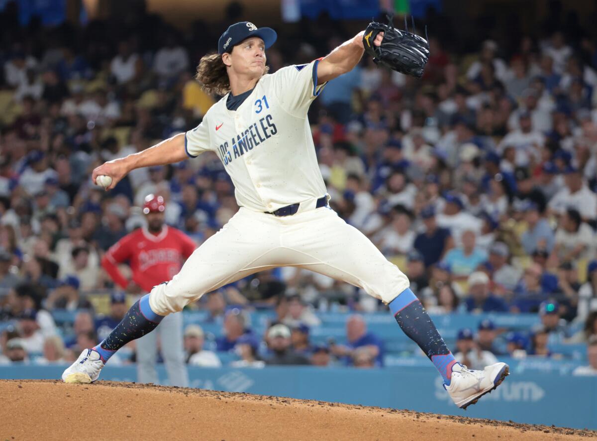 Dodgers pitcher Tyler Glasnow stretches out and throws from the mound 