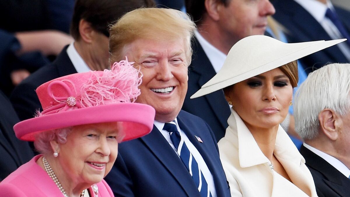 President Trump and First Lady Melania Trump sit next to Queen Elizabeth II during D-day commemorations in Portsmouth, Britain, on Wednesday.
