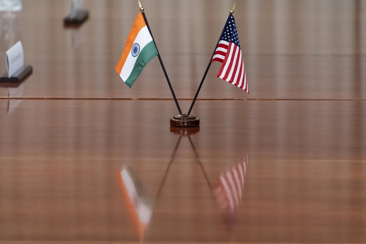 The flags of India and the United States on a table