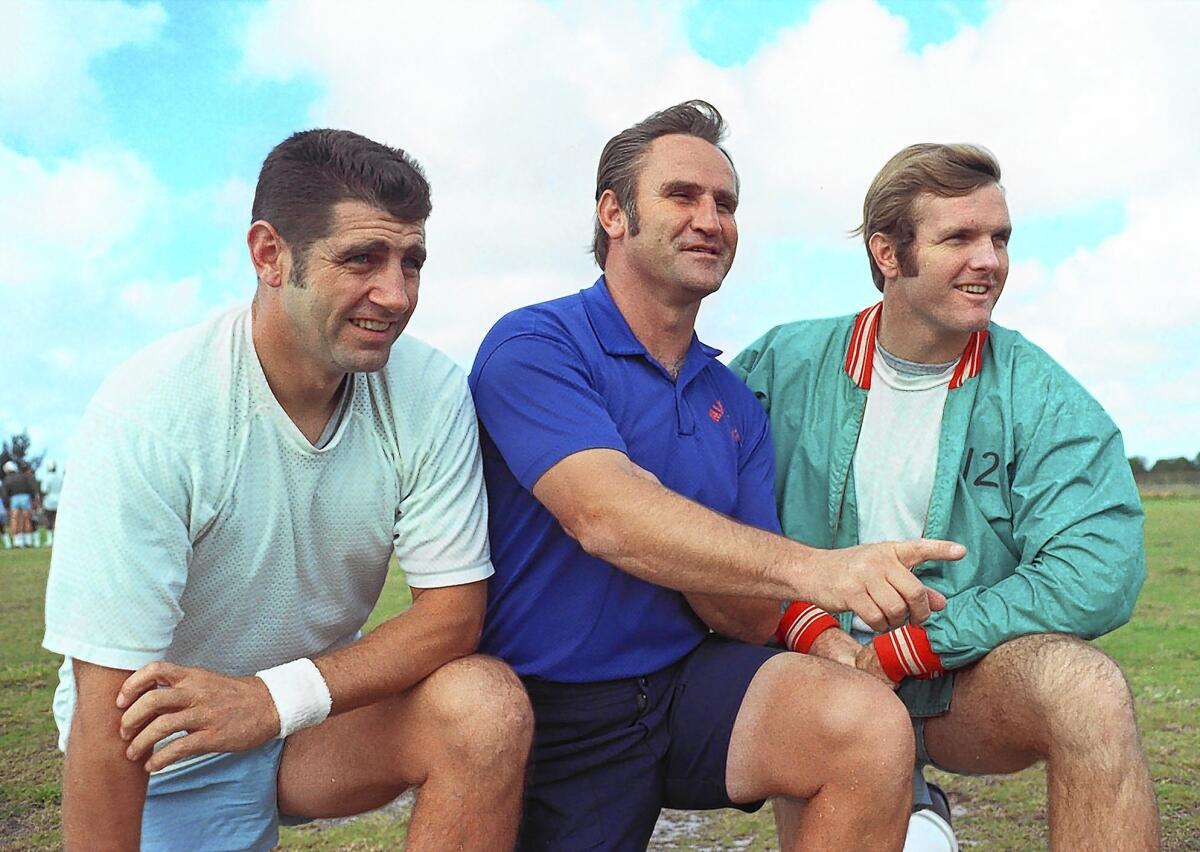 Backup quarterback Earl Morrall, left, with Miami Dolphins coach Don Shula, center, and Bob Griese. In the 1972 playoffs, Morrall guided Miami to a victory over Cleveland but was replaced by Griese after the Dolphins fell behind to Pittsburgh in the AFC title game.