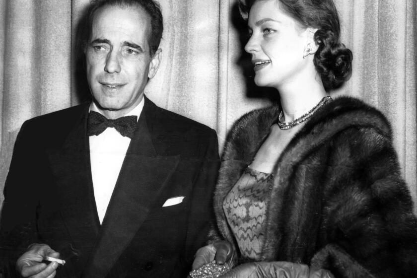 Lauren Bacall and Humphrey Bogart arrive for Academy Awards ceremonies in Los Angeles on March 20, 1952.