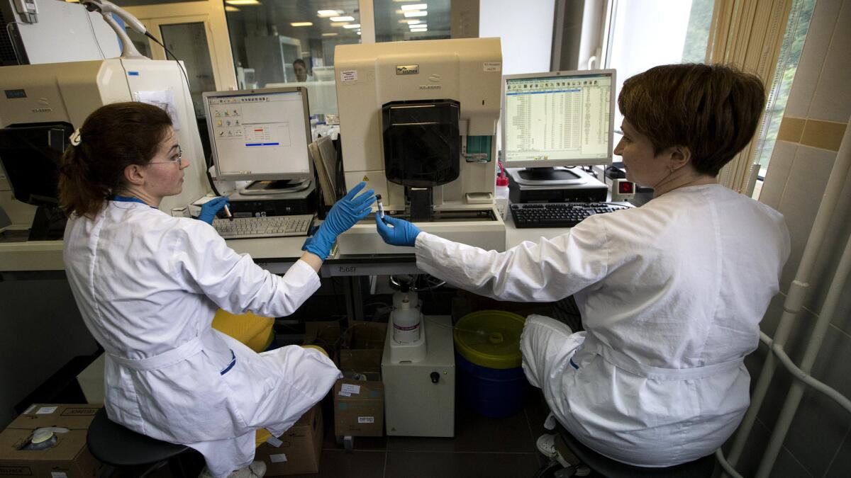 Workers at a Russian national drug-testing laboratory in Moscow are now joined by anti-doping observers from WADA and Britain.