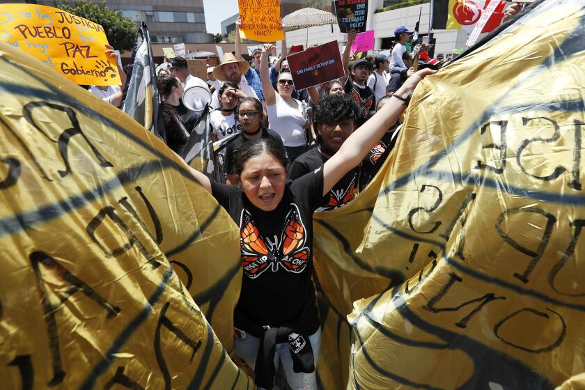 LOS ANGELES, CALIF. - APR. 30, 2018. Immigrants rights demonstrators march down Alamaeda Street in downtown Los Angeles on Saturday, June 30, 2018. (Luis Sinco/Los Angeles Times)