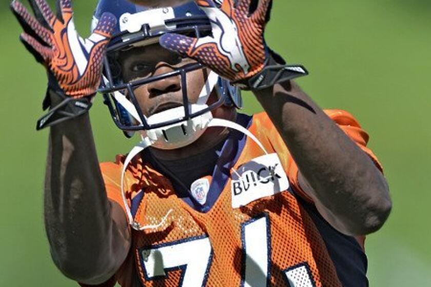 Broncos defensive back Quentin Jammer participates in a drill during practice Thursday.