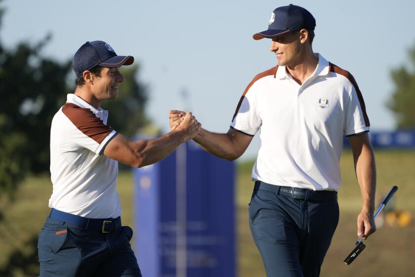 Europe's Ludvig Aberg, right, and playing partner Europe's Viktor Hovland celebrate on the 3rd free during their morning Foursomes match at the Ryder Cup golf tournament at the Marco Simone Golf Club in Guidonia Montecelio, Italy, Saturday, Sept. 30, 2023. (AP Photo/Gregorio Borgia )