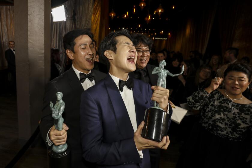 Sun-kyun Lee, Woo-sik Choi, director Bong Joon-Ho, and Jeong-eun Lee backstage at the 26th Screen Actors Guild Awards.