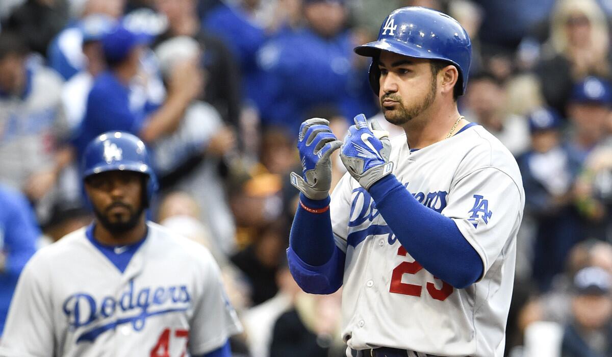 Dodgers' Adrian Gonzalez gestures as he scores a three-run home run during the second inning against the San Diego Padres on Saturday.