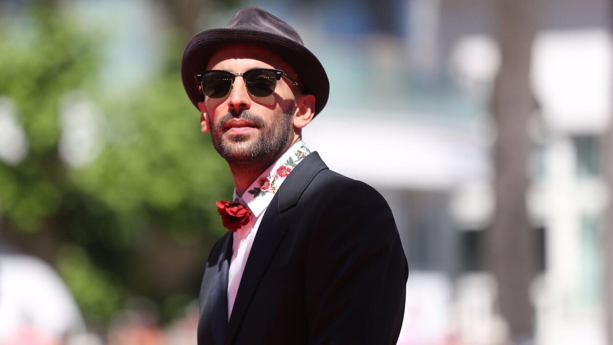French artist and photographer JR posing as he arrives for the screening of the film he co-directed with Agnes Varda, "Faces, Places" (Visages, Villages), at the 70th edition of the Cannes Film Festival. (Valery Hache / AFP / Getty Images)