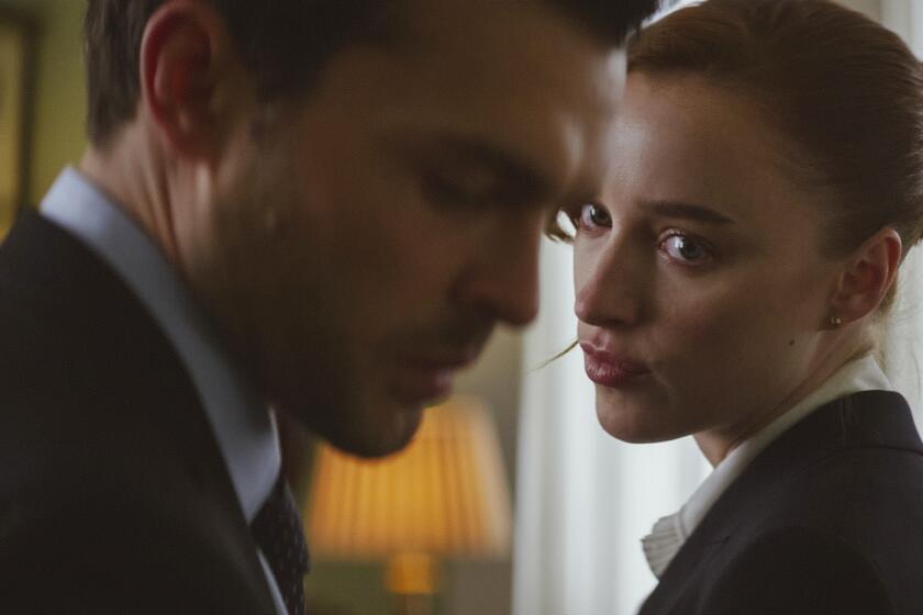 This image released by Netflix shows Alden Ehrenreich, left, and Phoebe Dynevor in a scene from "Fair Play." (Netflix via AP)