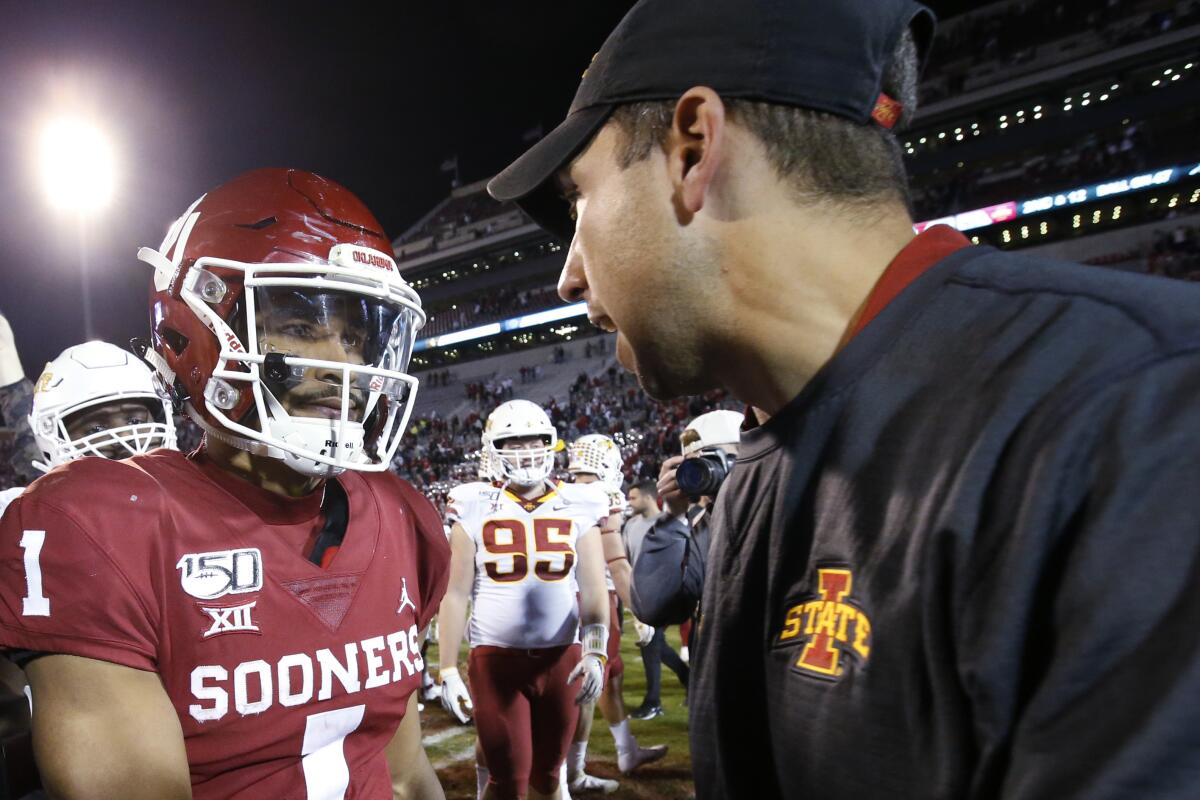 Oklahoma quarterback Jalen Hurts (1) talks with Iowa State head coach Matt Campbell following the Sooners' 42-41 win in 2019.