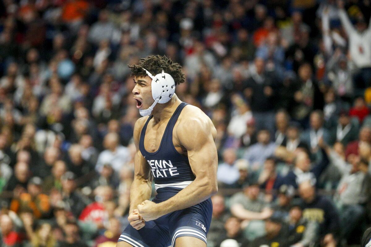 Penn State's Carter Starocci celebrates after defeating Nebraska's Mikey Labriola during the championship round at the NCAA Division I wrestling championships Saturday, March 18, 2023, in Tulsa, Okla. (Ian Maule/Tulsa World via AP)