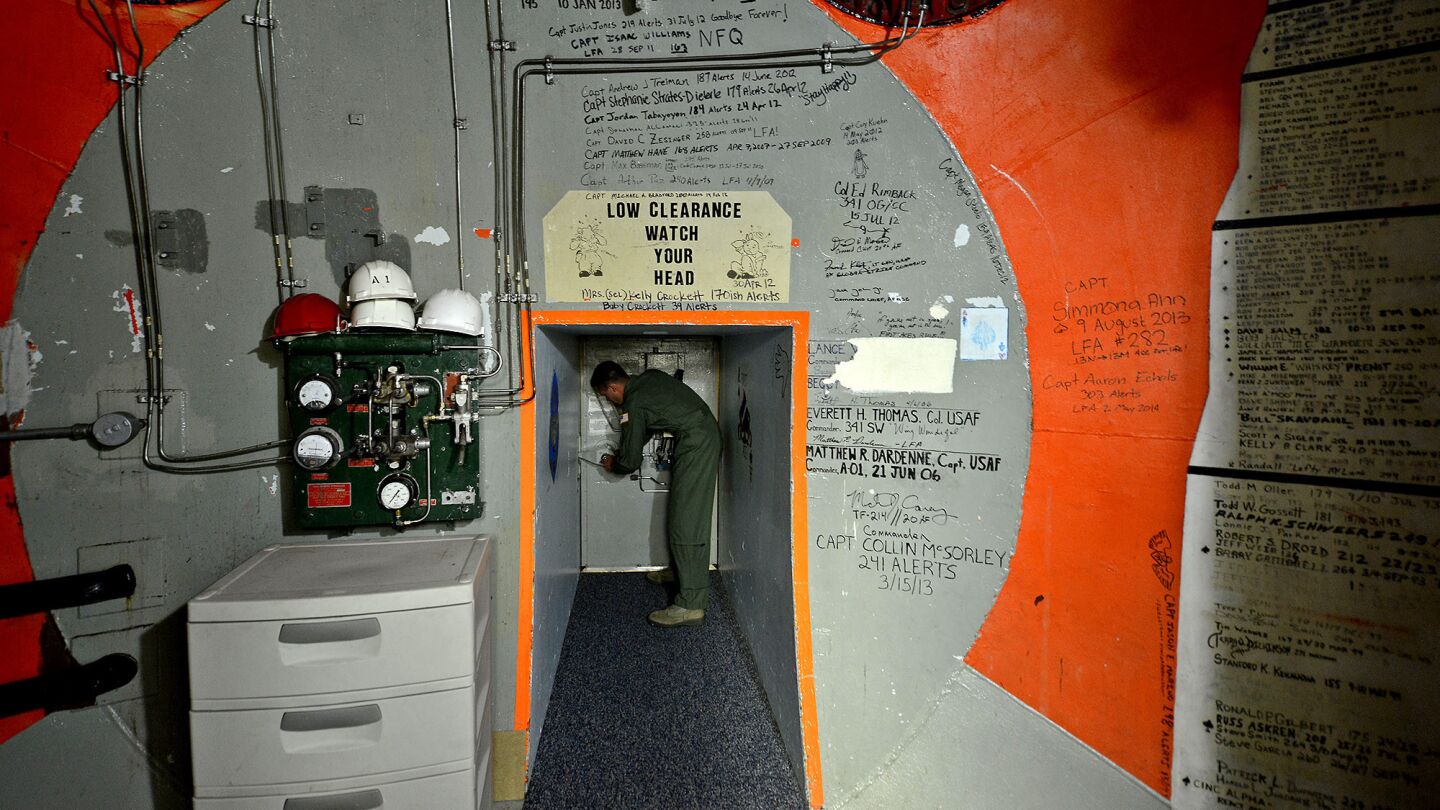 Griffith locks a 3-foot-thick door inside a launch control center at Malmstrom Air Force base.